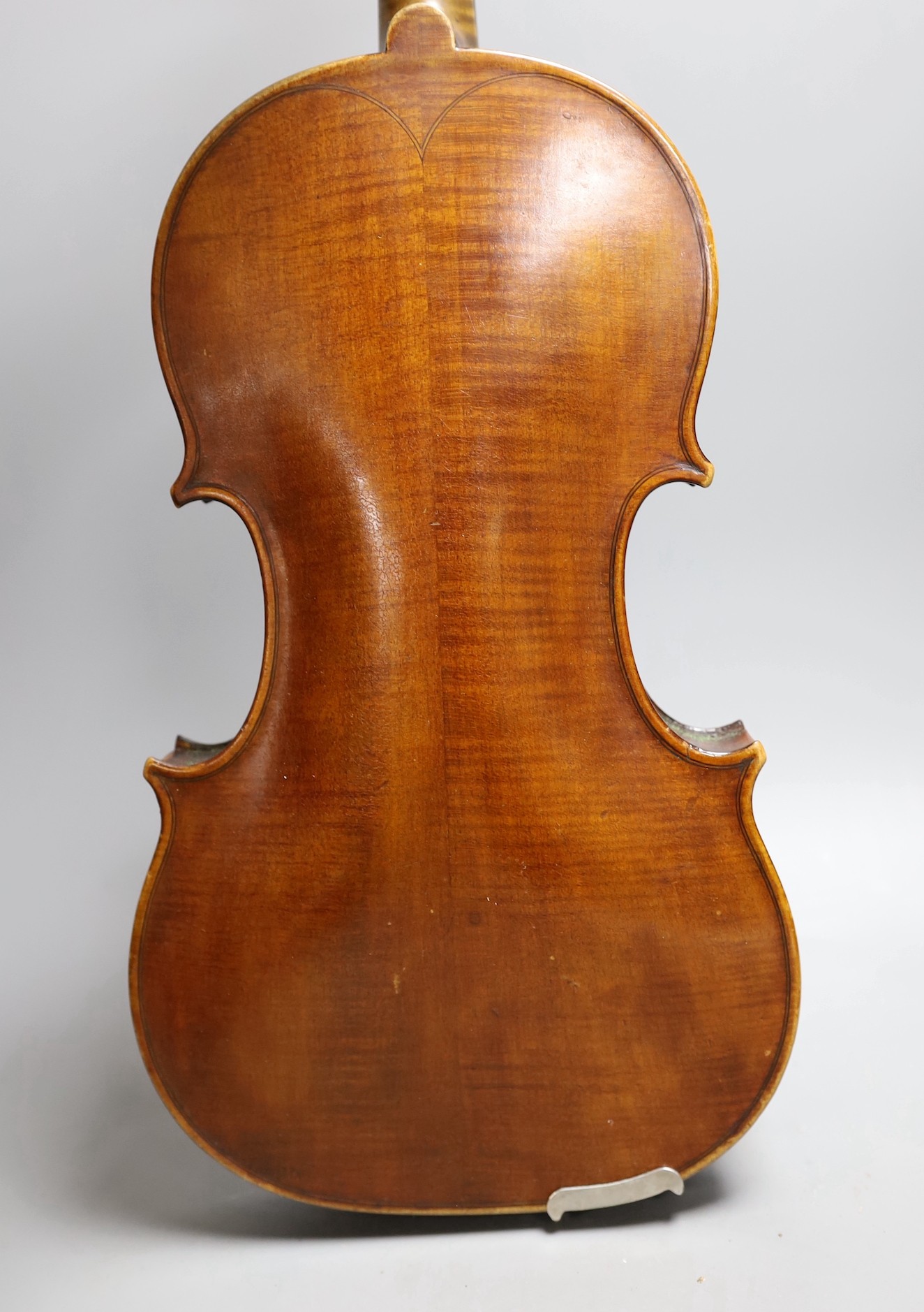 A cased late 19th century English violin, inscribed W. Heaton maker 1887 (?), back measures 35.5cm excl button